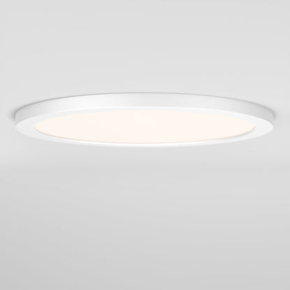 The Skylight Pro 15" 5K LED Flat Panel Light is a round, ultra-slim ceiling fixture that provides a soft, even glow on a white ceiling with adjustable brightness for personalized comfort.
