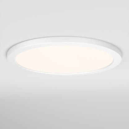 The Skylight Pro 15" 5K LED Flat Panel Light is an ultra-slim, round, flush-mounted ceiling light with a white frame and glowing center. It offers adjustable brightness for customizable illumination.